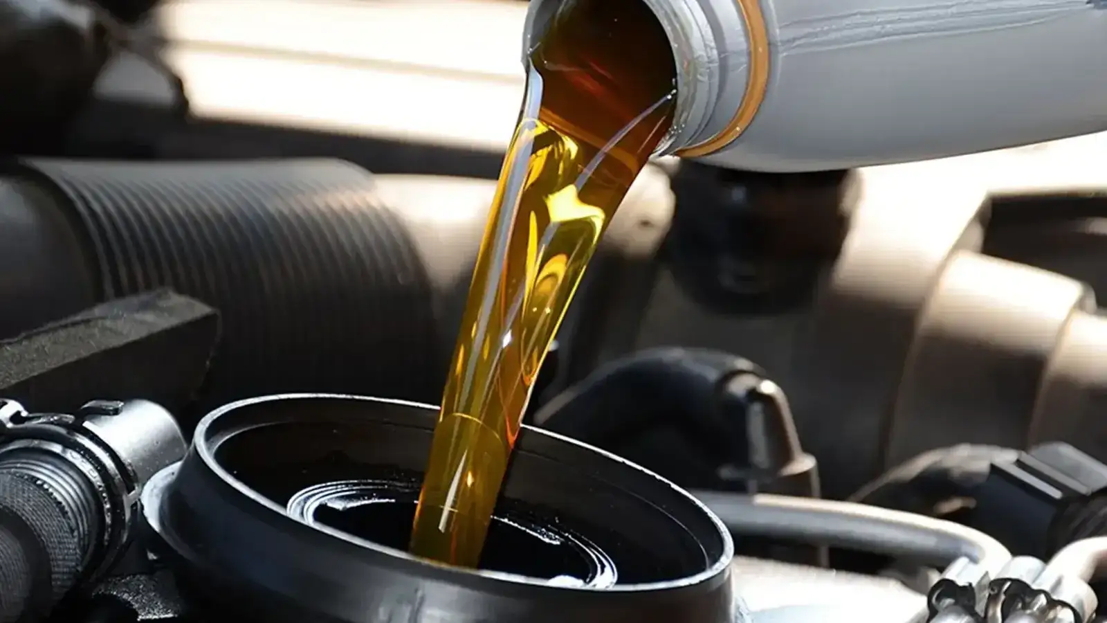 Close up of oil being added to a car engine